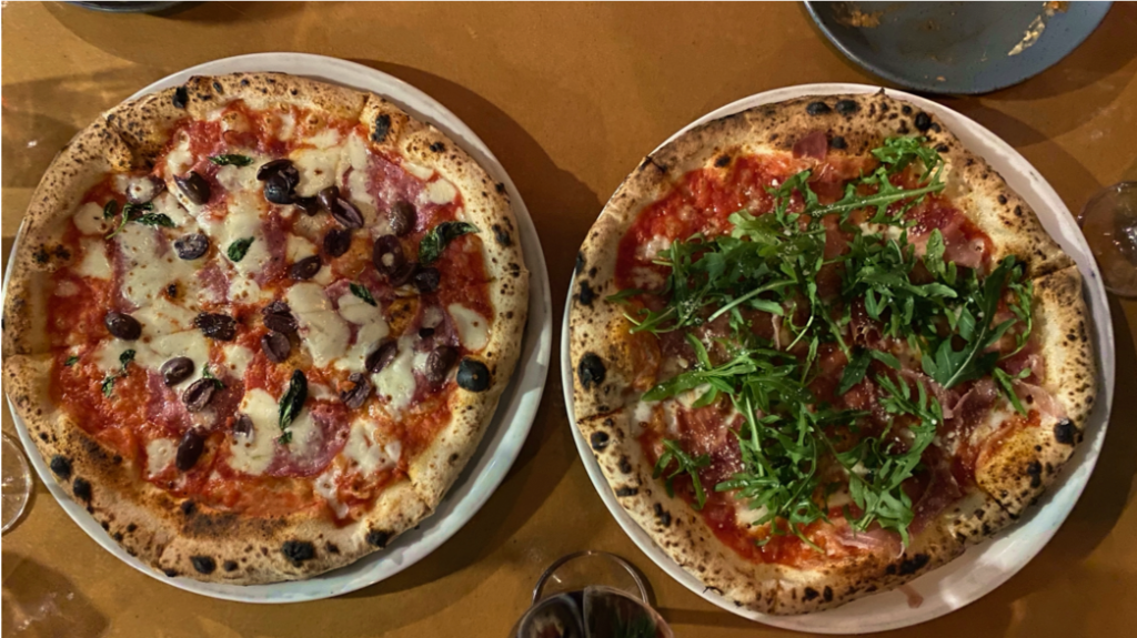 A pizza sitting on top of a table

Description automatically generated