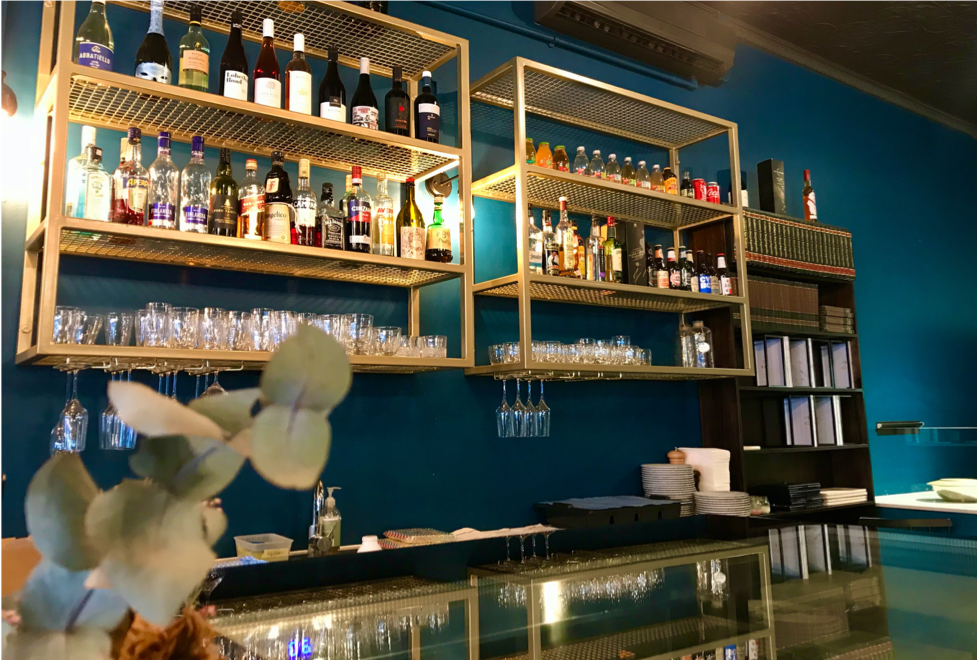 A picture containing indoor, shelf, library, table

Description automatically generated