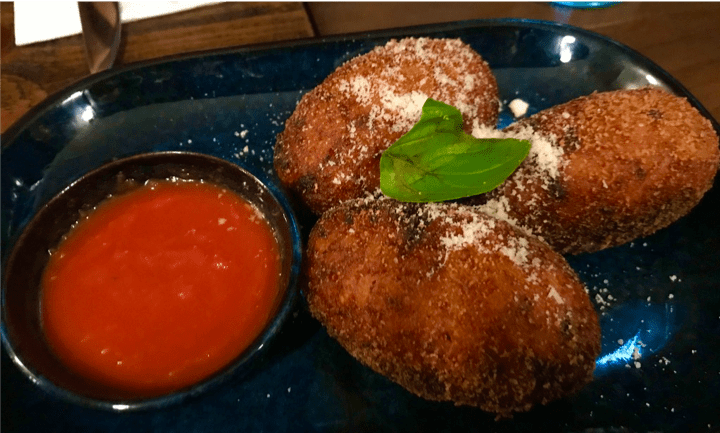 A pizza sitting on top of a table

Description automatically generated